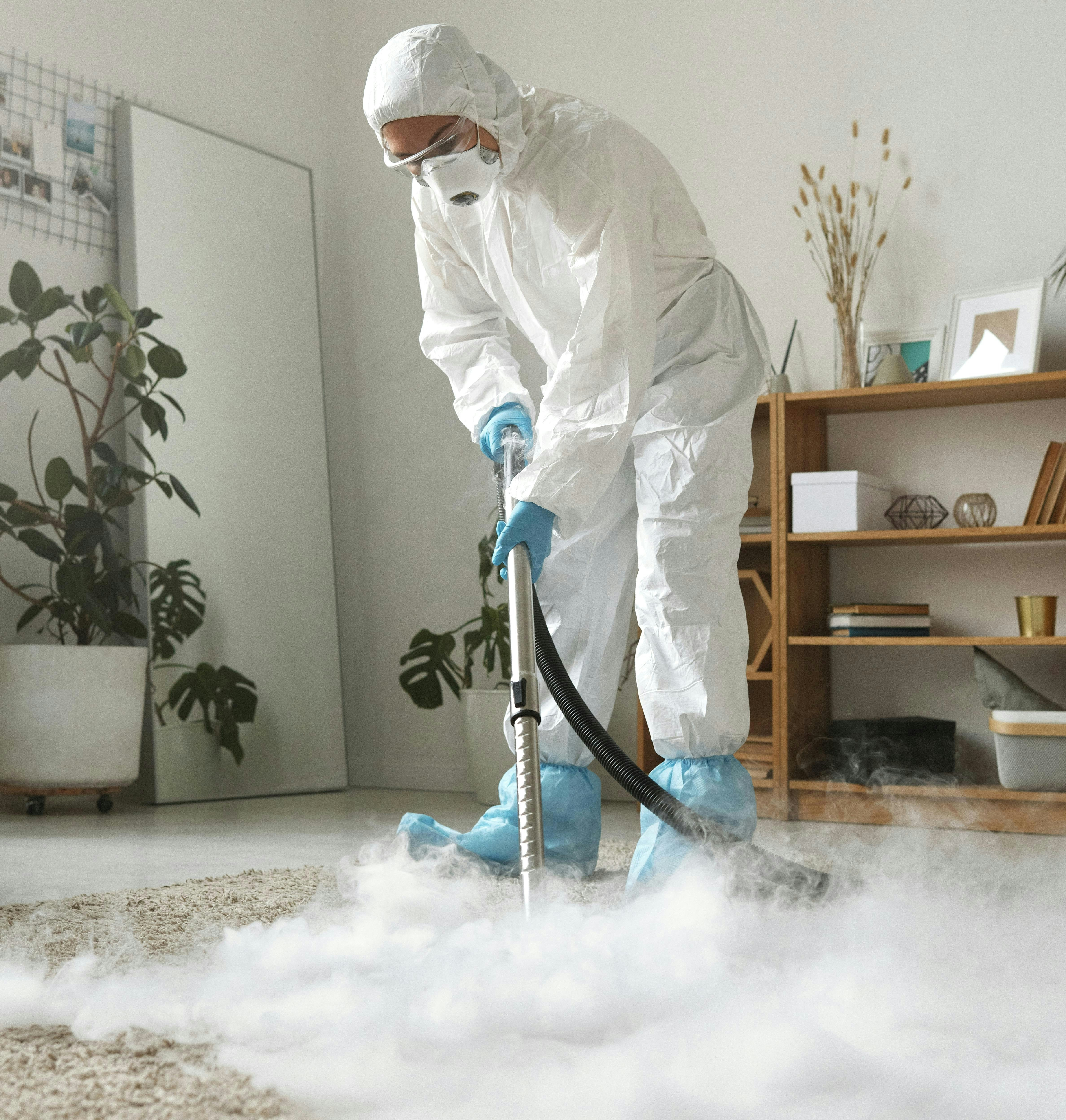 Wood Buffalo Cleaning crew member cleaning an office desk